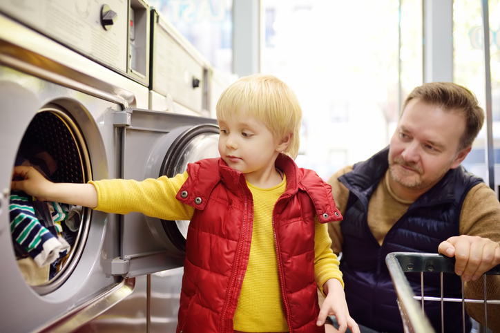 loading clothes at laundromat