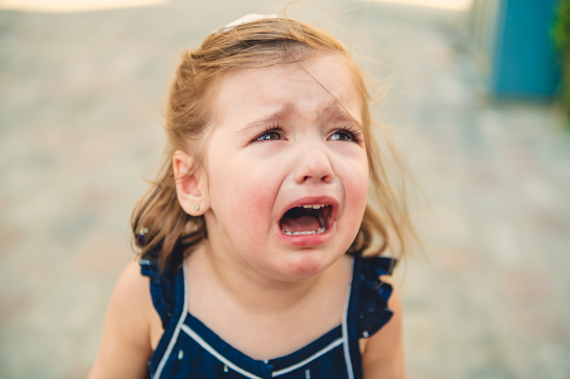 Crying kid at a laundromat