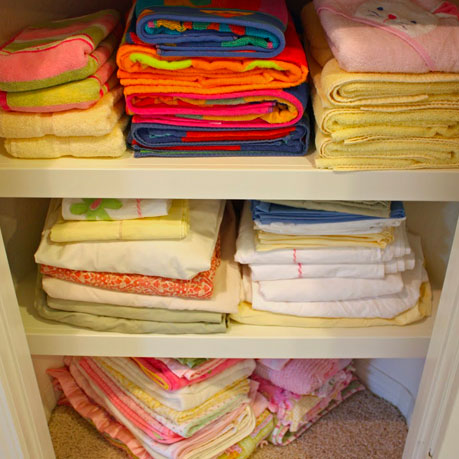 linen closet neatly stacked