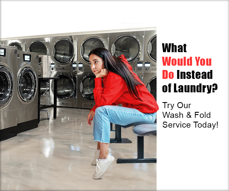 Bored girl watching her laundry wash at a laundromat.