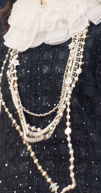 fashion trends chunky jewelry scarf and sequined sweater